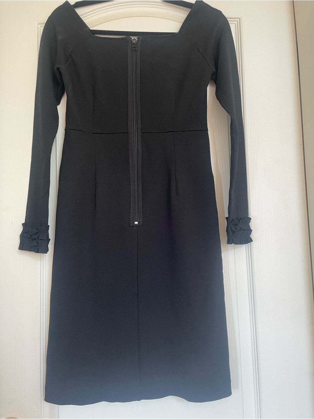 Off the Shoulder Black Dress by Pink Tartan with long sleeves and ruffled cuffs